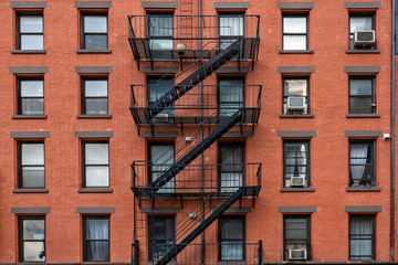 ancient brick buildings with fire stairs  in New York City