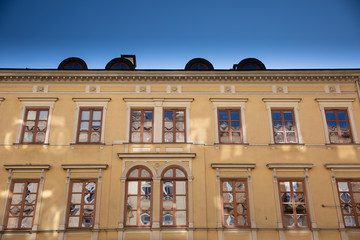 Old tenement house illuminated by bright sun light.