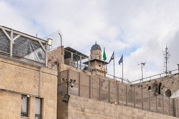 Fototapeta premium Western Wall Corner and El-Ghawanima Tower on the Temple Mount in the Old City of Jerusalem, Israel