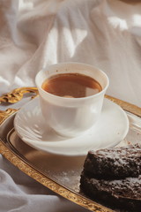 Morning coffee. morning. Black coffee in white mug. Sun rays. Sunny morning