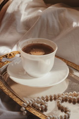  Morning coffee. morning. Black coffee in white mug. Sunny morning