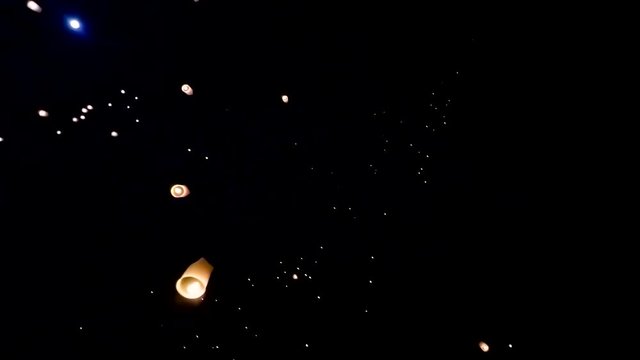 Many Sky Lanterns Floating Up To The Sky In Yee Peng Lanna International Landmark Destination Travel Of Chiang Mai, Thailand (long shot)