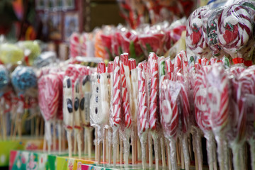 Lollipop candy on counter in shop. Group of packed colorful round lollipops on the market - 331209585