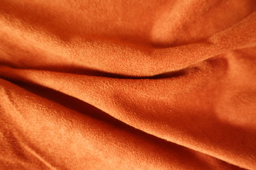 Rippled bright reddish orange artificial suede fabric