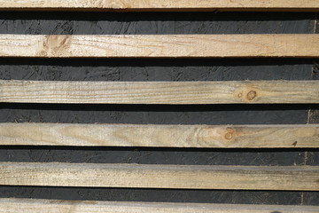 Thin horizontal unpolished and unpainted wooden planks