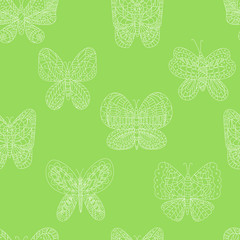 Hand drawn vector illustration. Seamless pattern with cute butterflies. Drawing with simple shapes, silhouettes, doodles, a sketch on a green background. For textiles and children 's decor.