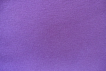 View of simple purple polyester fabric from above