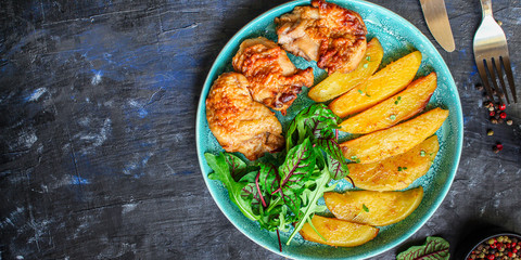 fried chicken and potatoes, keto or paleo diet menu concept food background. top view. copy space for text