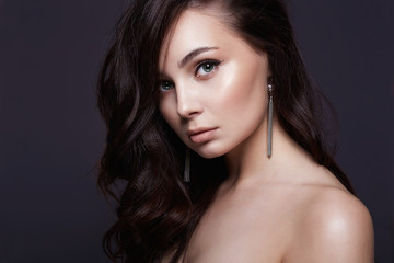 Fototapeta premium Beautiful young brunette woman with healthy curly hair