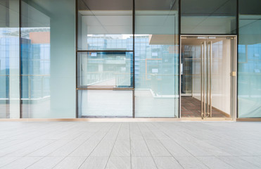 A modern office building with glass doors and windows