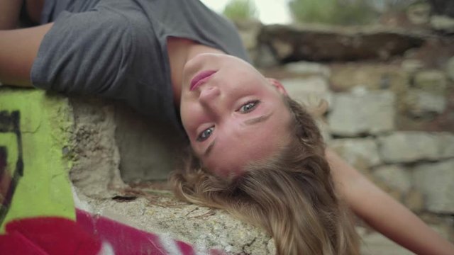 Slow motion shot of lying motionless woman on steps
