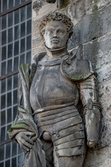 Obraz premium Ancient statue portrait of Saint Maurice (black Knight) as gatekeeper in Magdeburg Cathedral as Roman soldier from Thebes of 13 century, Magdeburg, Germany, closeup, details