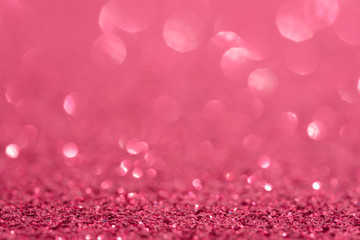 Glitter, sparkle defocused blurred pink background with bokeh lights