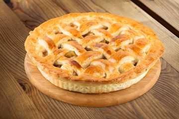 Delicious baked sweet pie on desk