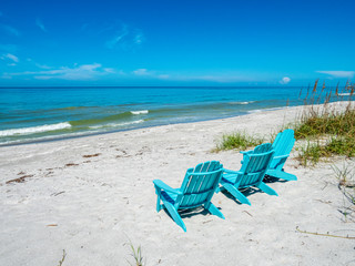 Fototapeta na wymiar Beach chairs on Gulf of Mexico beach on Longboat Key Florida