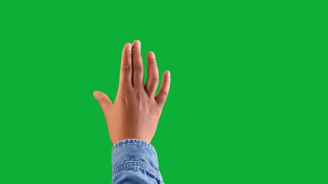 mixed race deep skin tone male hand makes a zoom gesture on white. one click keying on chromakey green