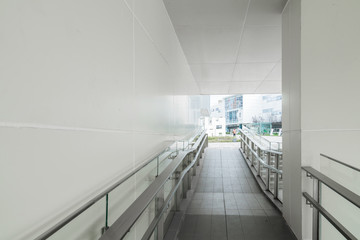 Pedestrian walkway with handrails in the office building