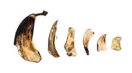 Decaying banana slices against white background