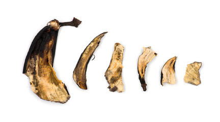 Decaying banana slices against white background
