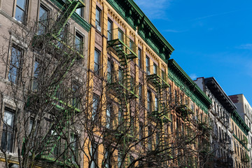 Fototapeta na wymiar Row of Colorful Old Brick Residential Buildings in Morningside Heights of New York City