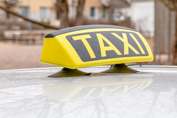 Detail of a taxi on the street.