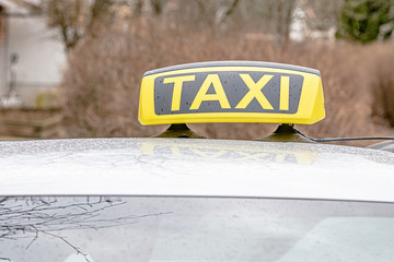 Detail of a taxi on the street.