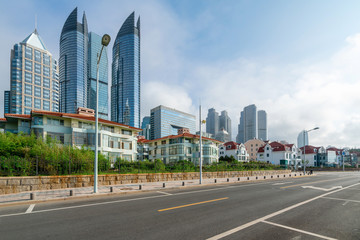 empty highway with cityscape and skyline of qingdao,China.