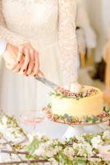 Yellow wedding cake with flowers