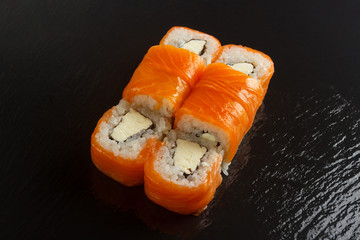 Japanese food: Set of salmon sushi and rolls with salmon and eel
