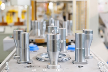 The steel cylindrical parts are on the machine platform