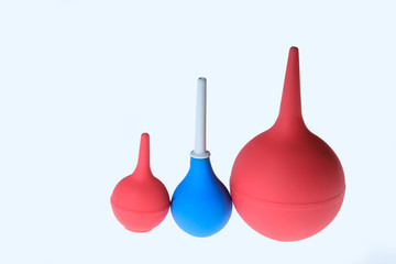 Red and blue enemas isolated. Medical new enema. Enema in medicine. different sizes of enemas