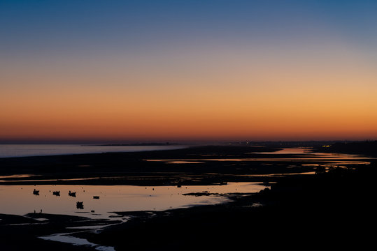 Sunset over the ocean in the Algarve from Cacela Velha © FRANCESCO