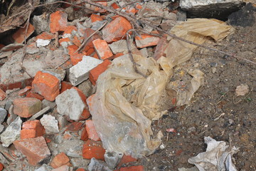 Construction waste with elements of and destroyed old structures at municipal landfill