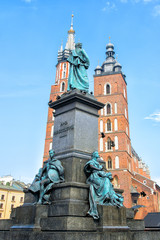 View of Main Market Square, Adam Mickiewicz Monument and St. Mary's Basilica in Krakow Old town