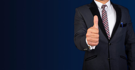 Businessman with thumbs up sign in suit with banner template