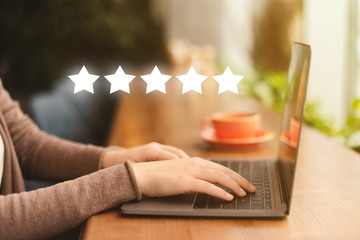 Businesswoman pressing button on high quality rating