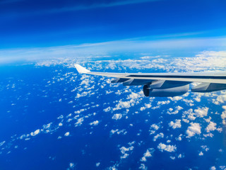 View from an airplane on a blue sky and white clouds.