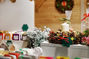 Festive wreaths and homemade soap displayed at Vilnius Christmas market