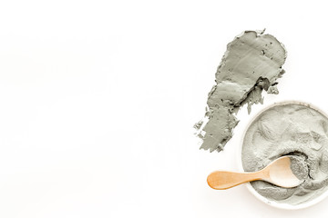 Texture of mud mask. Blue clay for face smears on white background top-down copy space