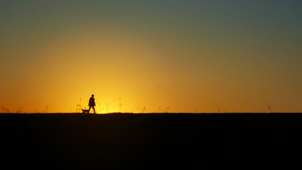 Fototapeta na wymiar A silhouette during the sunset