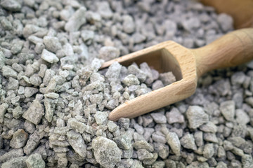 Image of salt natural mineral cubes in the bowl with wooden scoop
