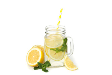 Glass jar with lemonade and lemons isolated on white background