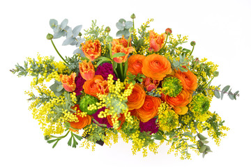 Fototapeta premium Flower arrangement on white background : Ranunculus, tulip, mimosa, eucalyptus, carnation, dracaena