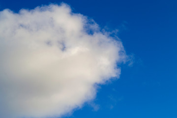 Bright white clouds on blue sky. Beautiful background.