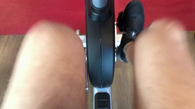 POV Man In The Gym Pedals An Exercise Bike