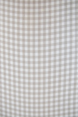 Abstract background of a fabric with a pattern of light squares with pastel shades