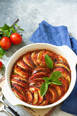 Ratatouille, vegetarian meal on a stone or slate table. Diet and healthy food concept.
