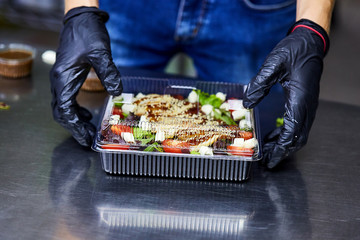 Vegetable salad with smoked eel in box ready for eating. Japanese Food Delivery Service