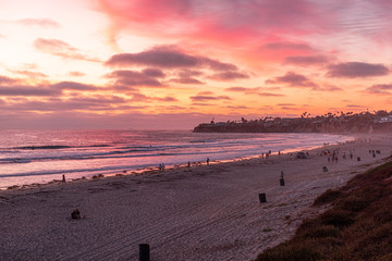 People doing activities during sunset at the Pacific Beach, San Diego, California