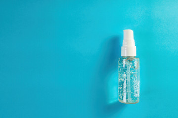 Alcohol gel on blue background. Top view of antibacterial soap sanitizer. Hygiene concept for prevent spread coronavirus